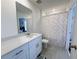 Bathroom featuring a single sink, a tiled floor, and a shower with a polka dot curtain at 2086 Crape Jasmine Ln, Orlando, FL 32824