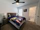 This cute bedroom has a ceiling fan and carpeted floors at 2086 Crape Jasmine Ln, Orlando, FL 32824