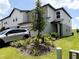 Inviting two-story home showcasing tasteful landscaping and a well-maintained lawn at 2086 Crape Jasmine Ln, Orlando, FL 32824