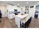 Stylish kitchen featuring a large center island, stainless appliances, and white cabinetry at 2086 Crape Jasmine Ln, Orlando, FL 32824