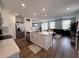 Inviting living room with a modern kitchen island and an open floor plan design at 2086 Crape Jasmine Ln, Orlando, FL 32824