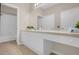 Neutral bathroom features an extended vanity and large mirror at 2307 Silver Palm Dr # 304, Kissimmee, FL 34747