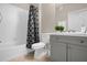 Cozy bathroom with a shower-tub combo and gray vanity at 2307 Silver Palm Dr # 304, Kissimmee, FL 34747