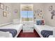 Cozy ' bedroom with twin beds, a neutral color scheme, and charming decor at 2307 Silver Palm Dr # 304, Kissimmee, FL 34747