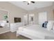 Stylishly decorated bedroom with lots of light and white furniture, including an attached bathroom at 2307 Silver Palm Dr # 304, Kissimmee, FL 34747