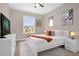 Bedroom with a comfortable bed, neutral walls, and entertainment center at 2307 Silver Palm Dr # 304, Kissimmee, FL 34747