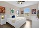 Stylishly decorated bedroom with lots of light and white furniture at 2307 Silver Palm Dr # 304, Kissimmee, FL 34747