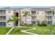 Beautiful condominium building featuring lush landscaping and outdoor living spaces at 2307 Silver Palm Dr # 304, Kissimmee, FL 34747