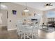 Dining area featuring a modern table and chairs with a view of the living room at 2307 Silver Palm Dr # 304, Kissimmee, FL 34747
