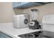 Close-up of the kitchen featuring bright countertops and stainless steel appliances at 2307 Silver Palm Dr # 304, Kissimmee, FL 34747