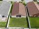 Aerial view shows backyard, lanai and roof of this home at 2912 Lazlo Ln, Orlando, FL 32837