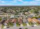 A high-angle view shows a community of houses nestled amongst green lawns and sidewalks at 2912 Lazlo Ln, Orlando, FL 32837