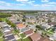 Breathtaking aerial capture of a serene suburban landscape featuring lush greenery and a tranquil lake at 2912 Lazlo Ln, Orlando, FL 32837