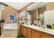 Bathroom includes double sinks, bathtub, shower and plenty of counter space at 2912 Lazlo Ln, Orlando, FL 32837