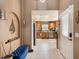 Inviting home entrance showcasing the foyer leading to the kitchen with a blue ottoman at 2912 Lazlo Ln, Orlando, FL 32837