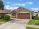 Charming single-Gathering home with a well-manicured lawn and an attached two-car garage at 2912 Lazlo Ln, Orlando, FL 32837