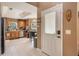 Spacious kitchen with light tile floors, wood cabinets, stainless steel appliances, and a doorway at 2912 Lazlo Ln, Orlando, FL 32837
