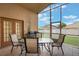 Screened lanai features seating area perfect for entertaining outdoors at 2912 Lazlo Ln, Orlando, FL 32837