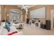 Spacious living room with high ceilings, tile floors, media center, and French doors to the lanai at 2912 Lazlo Ln, Orlando, FL 32837