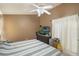 Comfortable bedroom with tiled floors and generous closet space at 2912 Lazlo Ln, Orlando, FL 32837