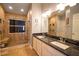 Elegant bathroom with a glass shower and a double vanity at 3030 Eagle Crossing Dr, Kissimmee, FL 34746