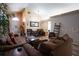 Cozy living room with hardwood floors and comfortable seating arrangement at 3030 Eagle Crossing Dr, Kissimmee, FL 34746