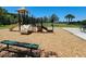 Community playground with play structures and seating area, providing a fun space for children at 3030 Eagle Crossing Dr, Kissimmee, FL 34746