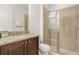 Cozy bathroom with glass shower, granite sink, and neutral color palette at 340 Pendant Ct, Kissimmee, FL 34747
