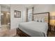Bright bedroom with white bedding, decorative curtains, and ensuite bathroom at 340 Pendant Ct, Kissimmee, FL 34747