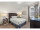Comfortable bedroom with a queen bed, mirrored nightstands and a full dresser, a calm and restful escape at 340 Pendant Ct, Kissimmee, FL 34747