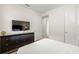 Bright bedroom featuring a dresser with a TV, and white walls providing a clean, modern aesthetic at 340 Pendant Ct, Kissimmee, FL 34747