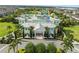 Clubhouse with a waterpark beyond and lush landscaping providing resort-style amenities and Gathering entertainment at 340 Pendant Ct, Kissimmee, FL 34747