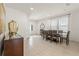 Bright dining room with a wooden table, tan tile floors, white walls and blinds at 340 Pendant Ct, Kissimmee, FL 34747