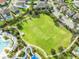 Lush green field with soccer goals and walking paths, perfect for outdoor activities and recreation at 340 Pendant Ct, Kissimmee, FL 34747