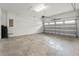 Spacious, clean garage with a concrete floor and a white door, providing ample parking and storage space at 340 Pendant Ct, Kissimmee, FL 34747