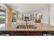 Granite kitchen island and sink looking towards the living room at 340 Pendant Ct, Kissimmee, FL 34747
