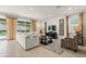 Bright living room featuring a comfortable sofa and large window with outdoor view at 340 Pendant Ct, Kissimmee, FL 34747