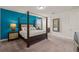 Well-lit bedroom with a four-poster bed and a glimpse into the bathroom at 340 Pendant Ct, Kissimmee, FL 34747