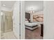 Main bedroom with ensuite bathroom, neutral paint and carpet at 340 Pendant Ct, Kissimmee, FL 34747