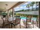 Enjoy patio dining with poolside views and palm trees at 340 Pendant Ct, Kissimmee, FL 34747