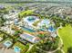 Vibrant aerial view of the community waterpark, showcasing an array of pools, slides, and amenities at 340 Pendant Ct, Kissimmee, FL 34747