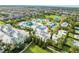 Aerial view of a waterpark, with colorful slides, pools, and palm trees, offering a fun-filled Gathering experience at 340 Pendant Ct, Kissimmee, FL 34747
