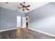 Spacious bedroom with an attached walk-in closet and an open door leading to the kitchen at 3427 Harborside Ct, Kissimmee, FL 34746