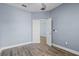 An empty bedroom featuring wood flooring and a closet at 3427 Harborside Ct, Kissimmee, FL 34746
