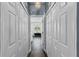 Hallway view to a bathroom with a clawfoot tub and decorative wallpaper at 3427 Harborside Ct, Kissimmee, FL 34746