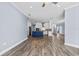 Open-concept living area showcasing tile floors, and natural light flowing into the kitchen at 3427 Harborside Ct, Kissimmee, FL 34746