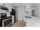 Well-lit kitchen featuring stainless steel appliances and stylish countertops at 437 Fountainhead Cir # 283, Kissimmee, FL 34741