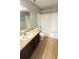 Bathroom with shower-tub combination and single sink vanity with dark cabinets at 4728 Walden Cir # 32, Orlando, FL 32811