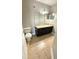 Bathroom featuring tile flooring and a single sink vanity with dark cabinets at 4728 Walden Cir # 32, Orlando, FL 32811