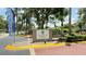 Welcoming entrance to Walden Palms, showcasing lush landscaping and a welcoming community vibe at 4728 Walden Cir # 32, Orlando, FL 32811